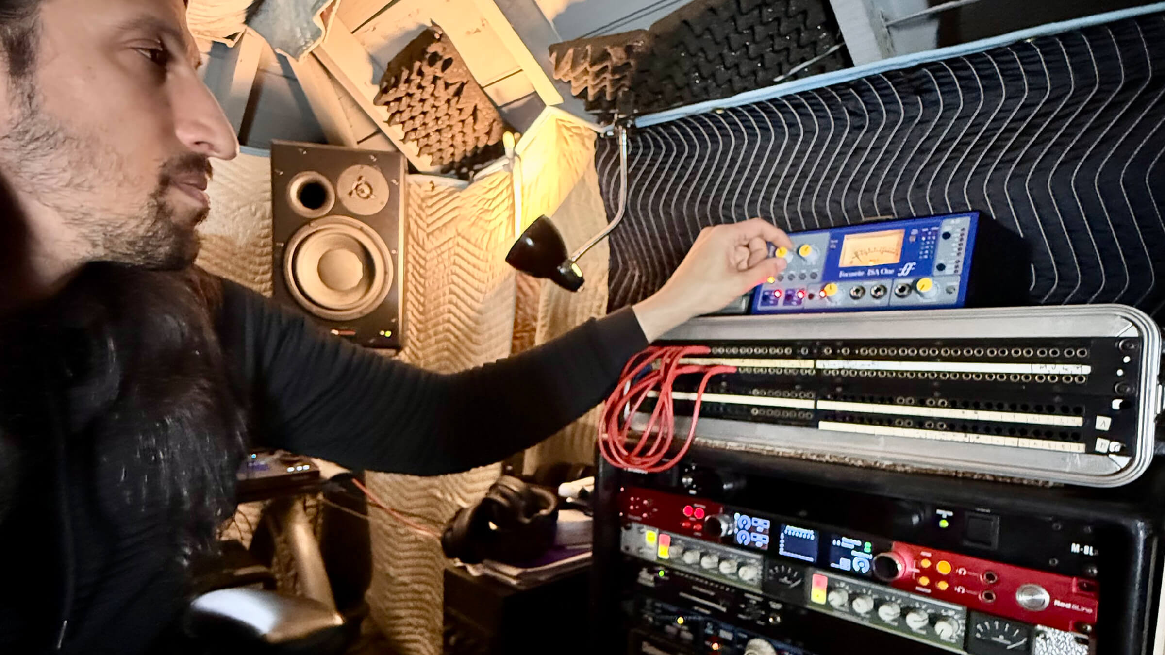 Josh Gannet, pictured with some of his gear components, including a Focusrite Red 8Line interface.